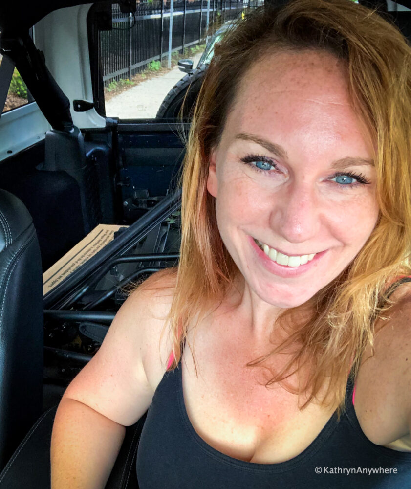 Kathryn Dickson, also known as Kathrynanywhere selfie in a Jeep
