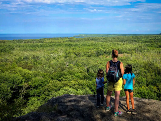 Mother and two children on look out point at Skinner's Bluff on the Bruce Peninsula