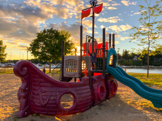 child playing at sunset in a playground at 1000 islands